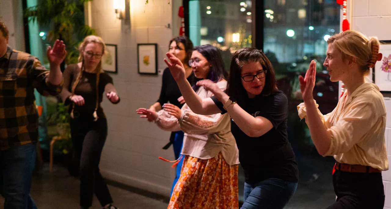 Many people dancing indoors